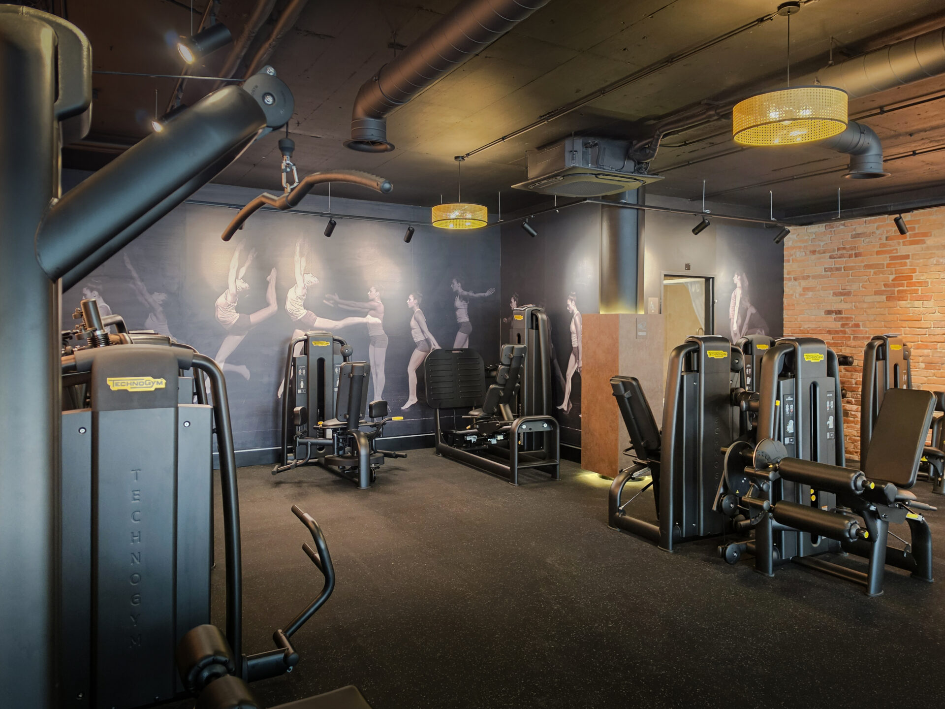 Strength training area with modern Technogym equipment at EVO Zurich Dubendorf.